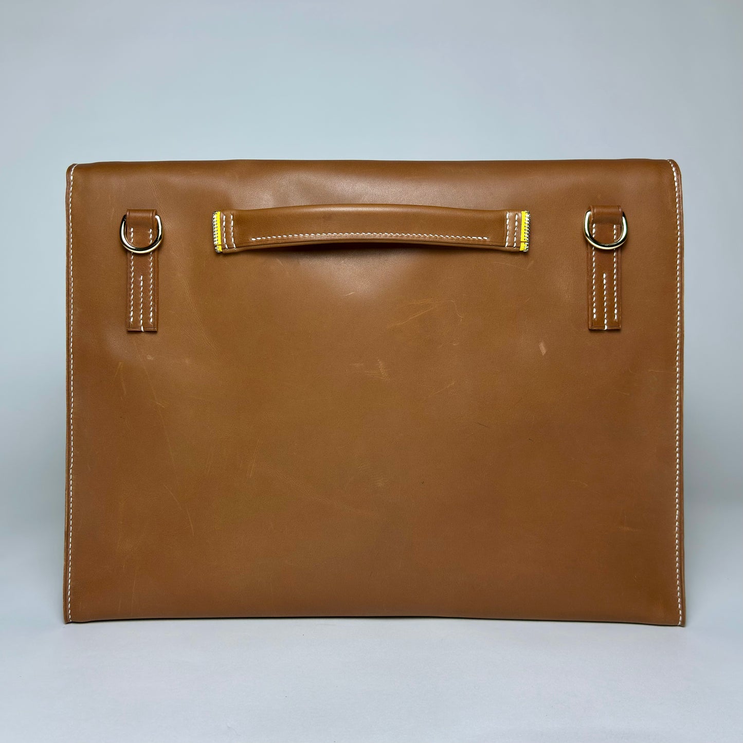 item no 10. yellow zipper briefcase