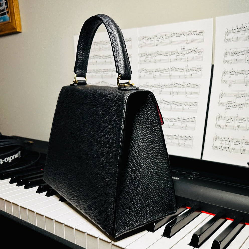 item no 12. trapezoidal purse